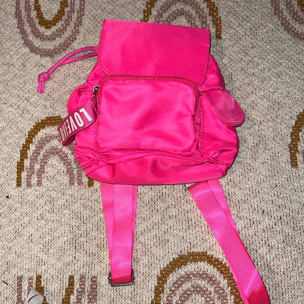 Mini pink back pack/bag Claire’s new with tag snap front 2 side pockets 1 front